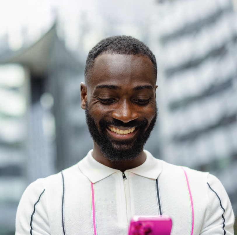 man on a pink mobile phone