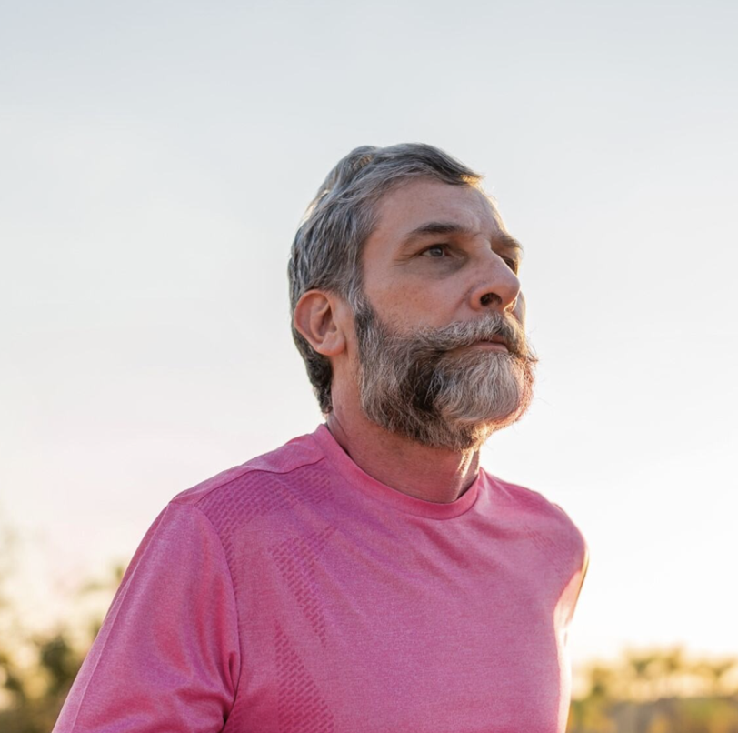 man jogging wearing pink
