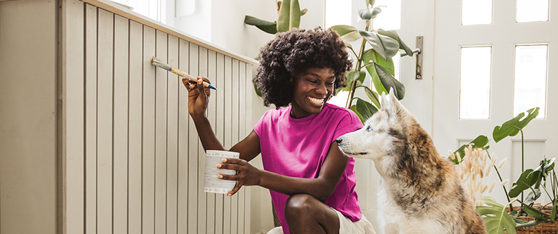 Woman decorating with dog